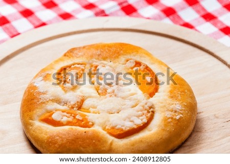Similar – Image, Stock Photo Apricot pie with one sliced piece. Top view of a lattice crust pie