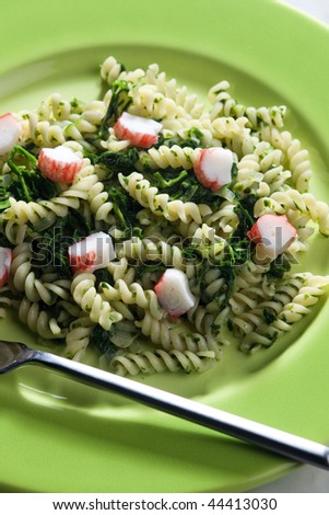 pasta fussili with crab sticks and spinach