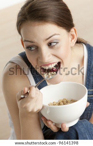 portrait of woman eating cereals