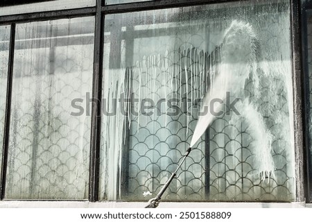 Similar – Image, Stock Photo Man washing window in yellow rubber gloves