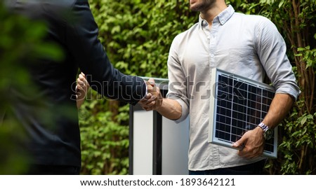Electrical Engineer Technician and CEO executive business people making handshake after meeting. clean and green alternative energy concept.