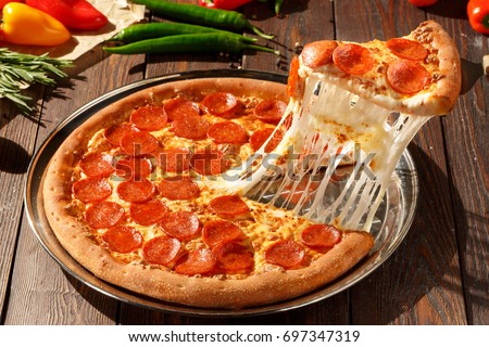 Similar – Foto Bild Pizzasalami in Scheiben geschnitten. Pizza-Peperoni-Scheiben. Hausgemachtes Abendessen