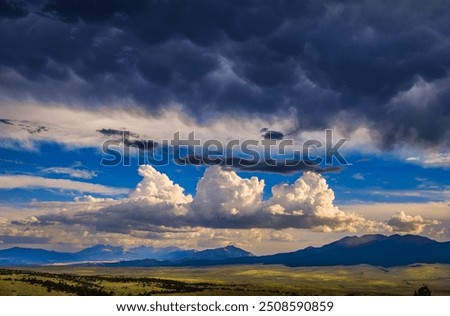Similar – Image, Stock Photo Distant traveler on rocky formation in sea