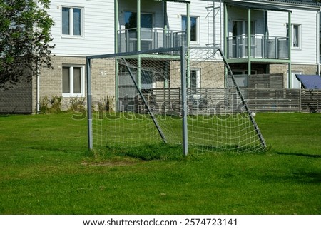 Similar – Image, Stock Photo Metal soccer goal on the soccer field, which was closed with a flutter band because of Corona