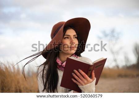 https://image.shutterstock.com/display_pic_with_logo/4243726/520360579/stock-photo-young-beautiful-woman-in-hat-walking-on-the-beach-outdoors-autumn-lifestyle-european-girl-in-warm-520360579.jpg
