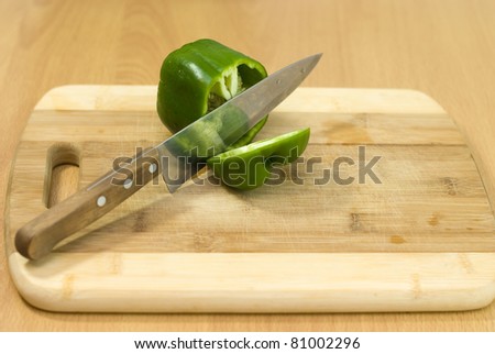 green pepper cut with a knife