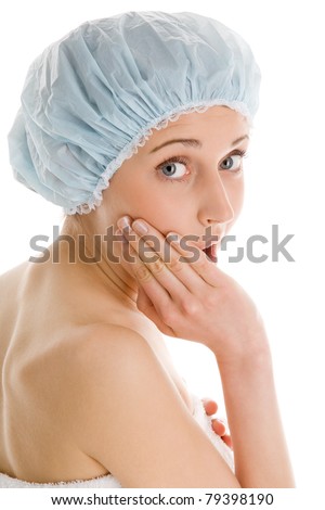 Young woman wearing bath cap