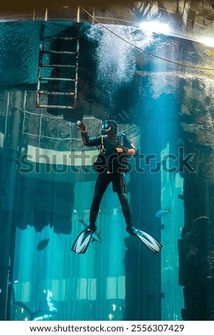 Similar – Image, Stock Photo Diver surrounded by bubbles jumping in water