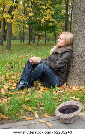 Sad Girl Sitting Under The Tree In The Autumn Park Stock Photo 62231248 ...