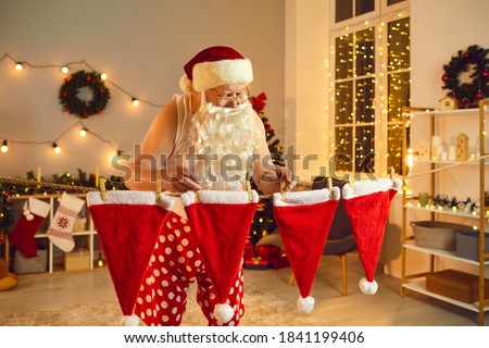 Similar – Image, Stock Photo Getting laundry out of the washing machine