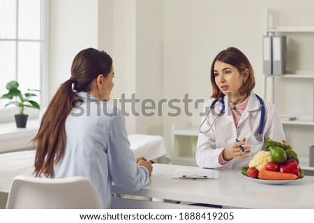 Similar – Image, Stock Photo Fitness woman consulting her training on her smartphone sitting in a jump box in the gym