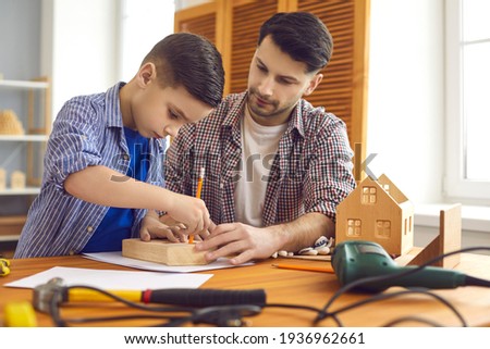 Similar – Image, Stock Photo Male woodworker teaching son in workshop