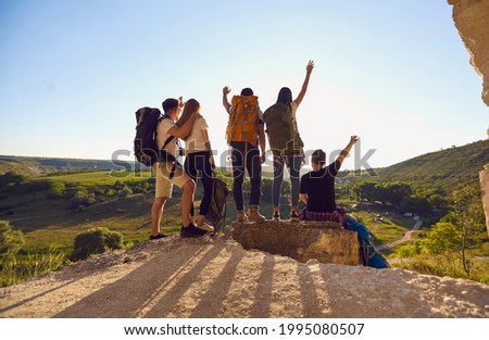 Similar – Image, Stock Photo Anonymous traveler on hill on misty day