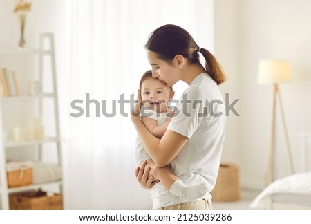 Similar – Image, Stock Photo Mother holding little baby on hands in room