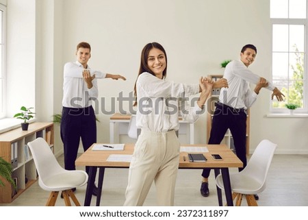 Similar – Image, Stock Photo Group of people doing exercises on pilates reformer