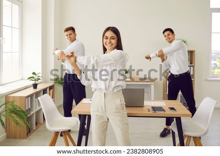 Similar – Image, Stock Photo Group of people doing exercises on pilates reformer