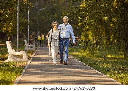 Similar – Image, Stock Photo portrait of two caucasian lovers. Young couple is hugging on autumn day outdoors. A bearded man and curly woman in love. Valentine’s Day. Concept of love and family.