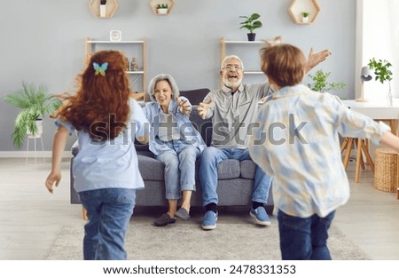 Similar – Image, Stock Photo Grandpa and grandson sitting on a bench in the forest