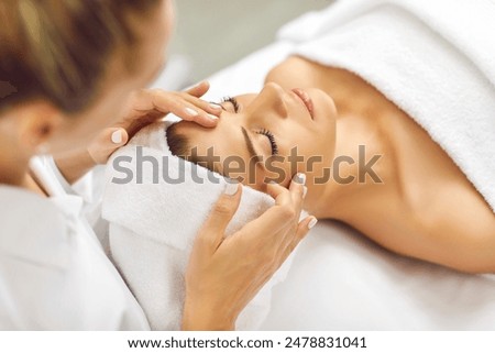 Similar – Image, Stock Photo Young woman lying in bed suffering, tired woman covering face with hands, can’t sleep feels exhaustand on white sheets in bedroom