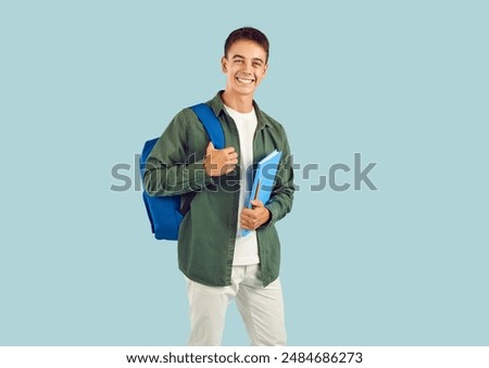 Similar – Image, Stock Photo A happy teenager is texting on a mobile phone, lying on the floor in the living room. Modern technologies, online communication