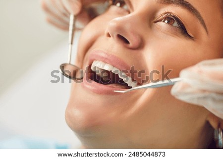 Image, Stock Photo Crop dentist examining teeth of patient in clinic