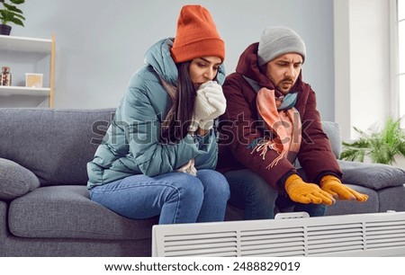 Similar – Image, Stock Photo Woman sitting on frozen river and tying the shoelaces