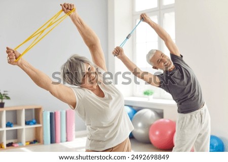 Similar – Image, Stock Photo Senior woman exercising at home