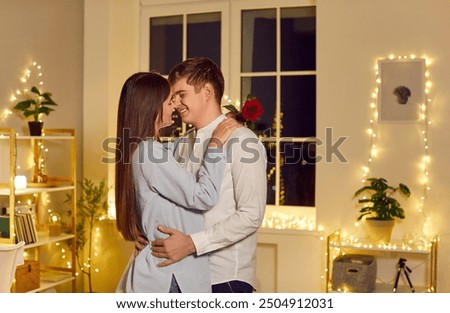 Similar – Image, Stock Photo Delighted couple hugging during sunset in nature