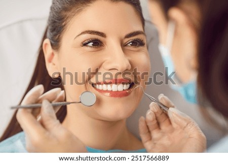 Similar – Image, Stock Photo Dentist treating teeth of patient with UV light