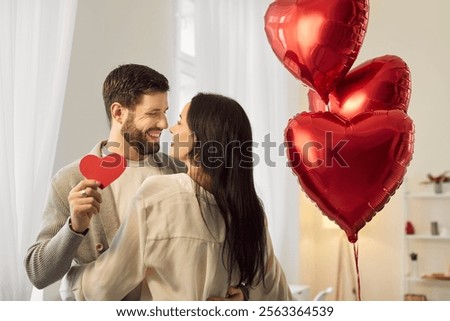 Similar – Image, Stock Photo Delighted couple hugging during sunset in nature