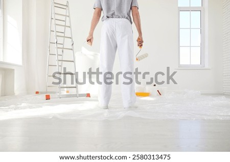 Similar – Image, Stock Photo Crop man painting on studio floor