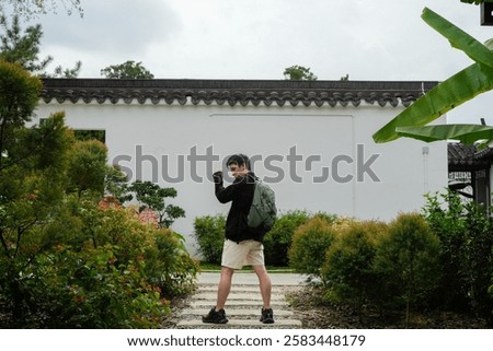Similar – Image, Stock Photo Path through stone gate overgrown with ivy