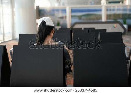 Similar – Image, Stock Photo Anonymous girl in airport terminal