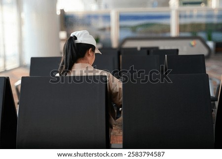 Similar – Image, Stock Photo Anonymous girl in airport terminal