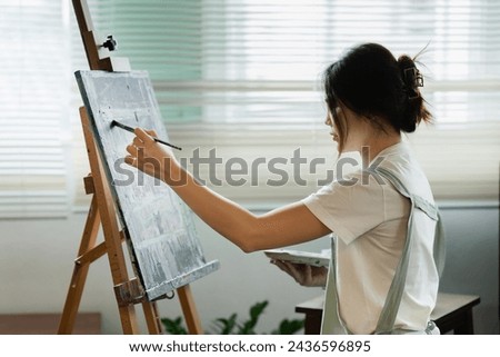 Similar – Image, Stock Photo a girl paints something in the sand with her finger on a beach