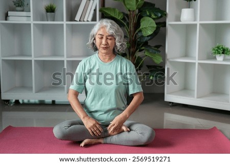 Similar – Image, Stock Photo Focused Senior Woman Practicing Yoga With Hands Clasped