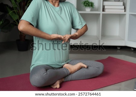 Similar – Image, Stock Photo Focused Senior Woman Practicing Yoga With Hands Clasped