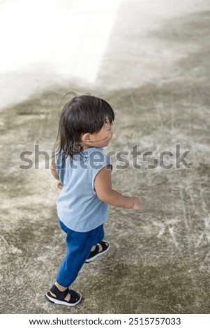 Similar – Image, Stock Photo Little boy walking across meadow, father in the background