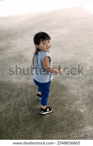 Similar – Image, Stock Photo Little boy walking across meadow, father in the background