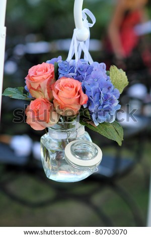 Flower arrangmnet, hanging glass jar, at wedding,