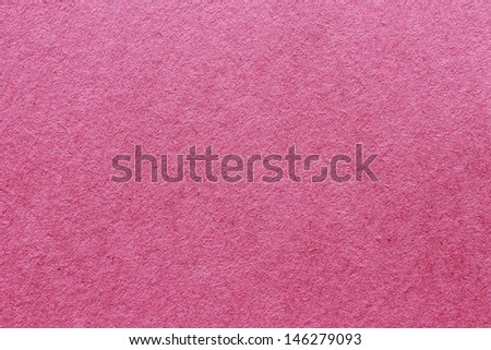 close up aka macro shot of pink construction paper, showing texture, paper fibers, flaws, and more. the perfect image for all your colored construction or recycled paper needs
