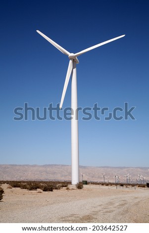 A Genuine Earth Saving Electrical Generating Wind Turbine sits in the Hot Dry Desert of Palm Springs California, making Free Green Electricity with the power of the wind for the greater good of man