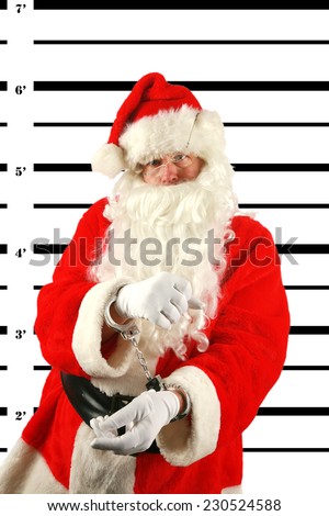 Santa was arrested for being a Bad Boy after getting drunk on elderberry wine left out by the elves. Apparently Elves feel no effect from Elderberry Wine but it looks like Santa sure does.