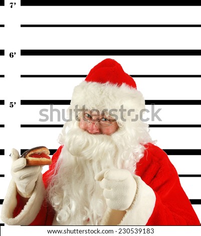 BUSTED. Santa Claus is arrested and his MUG SHOT taken at the Police Station. Santa was a Bad Bad boy.