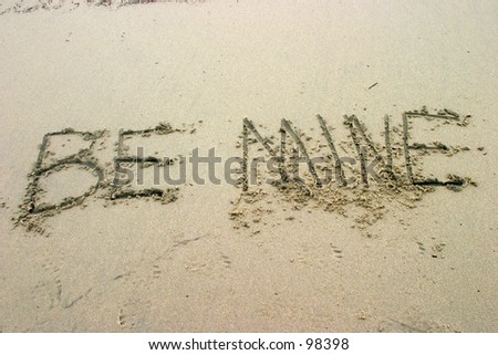 BE MINE written in sand on the beach just in time for Valentines day