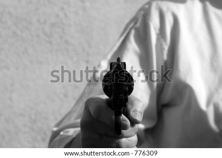Black and White Hand Gun being pointed directly at YOU the viewer