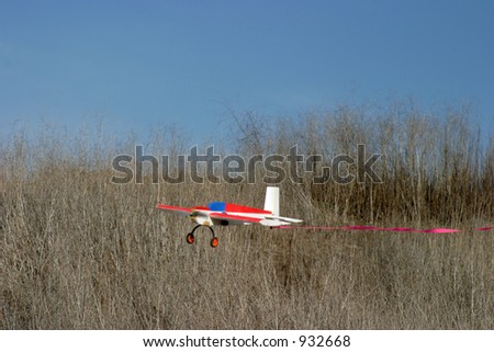 remote controlled airplane zips through the sky