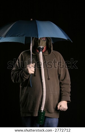 Apocalyptic acid rainy day A man in a gas mask holds a blue umbrella to protect himself from the acid rain in a futuristic nuclear wasteland
