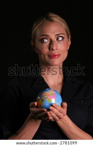 an attractive young woman holds the earth in her hands representing 