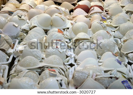 a large collection of bra's for sale in an outdoor market